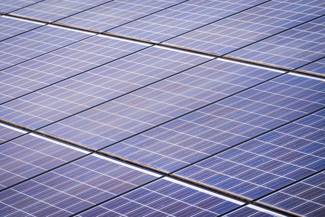 Close-up of a solar panel array capturing renewable energy on a sunny day.